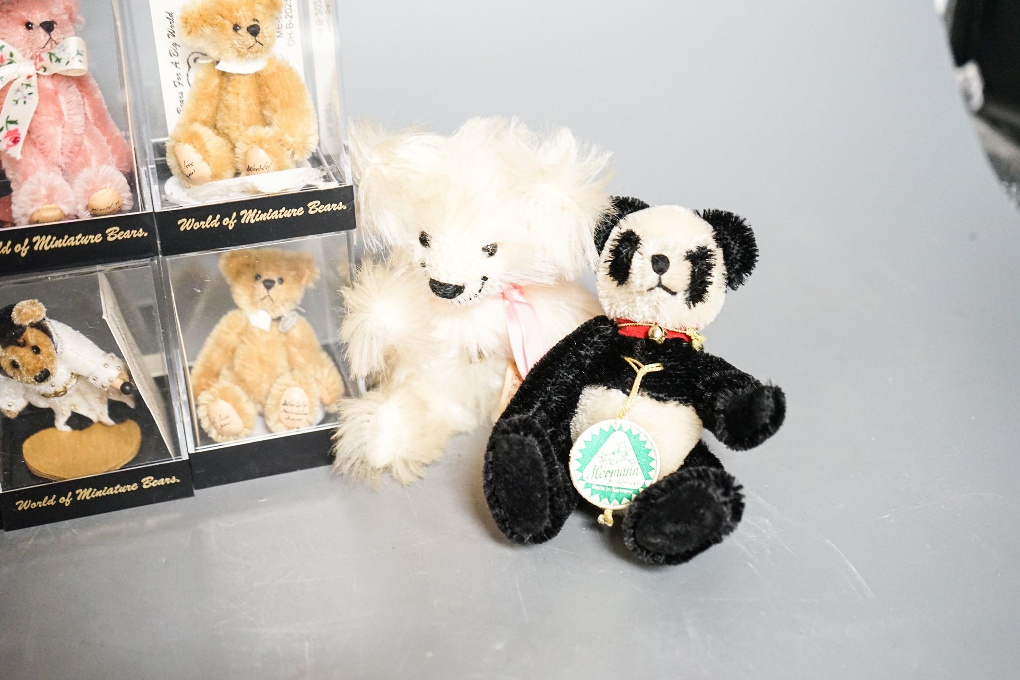 Seven World of Miniature Bears and one Grisley and one Herman
